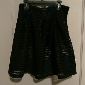 Black Mini skirt with floral print slip. Size M